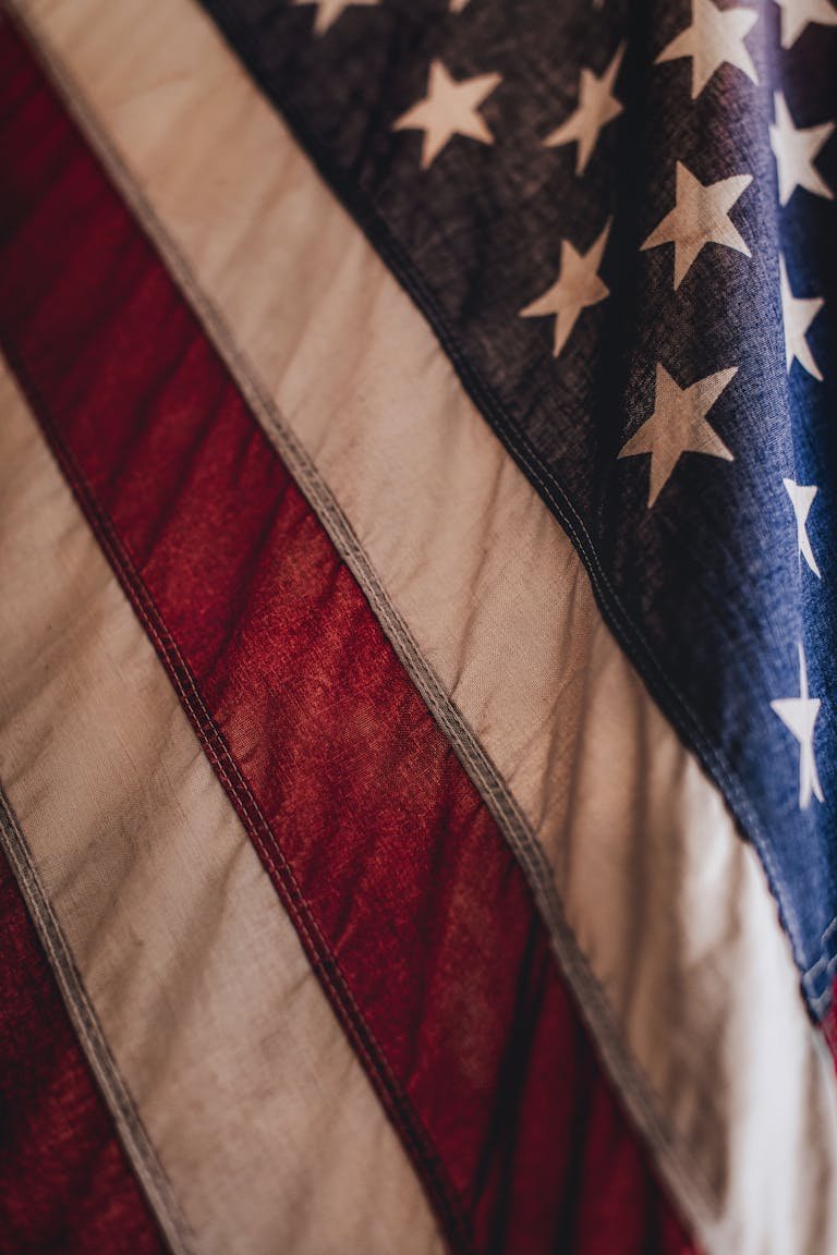 A detailed close-up of the American flag showcasing stars and stripes, ideal for patriotic themes.